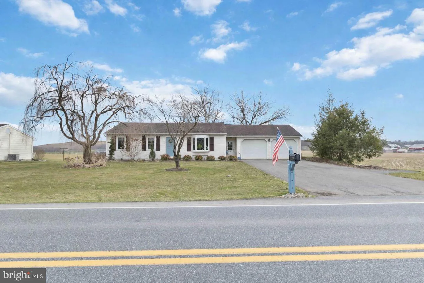 Professional exterior listing photo of a ranch home marketed by Team Sechman